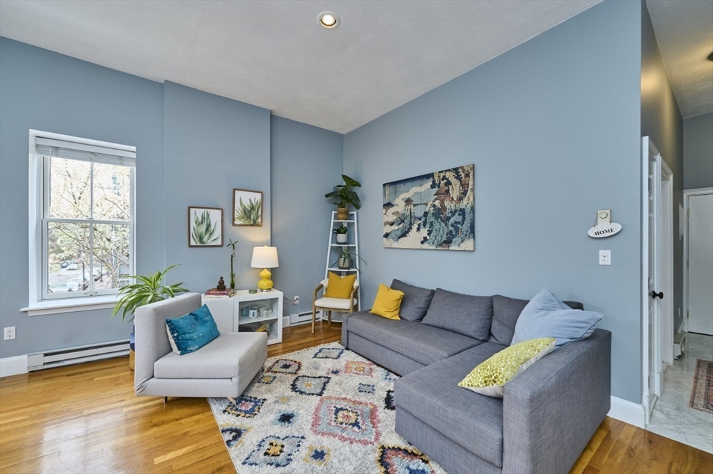 516 Shawmut Avenue, Unit 2 Boston, MA 02118 - Photo 2 of 13 a living room with furniture and a window