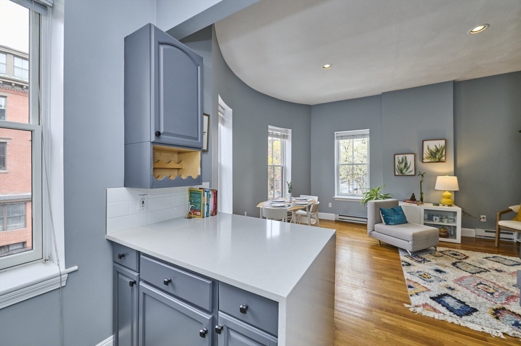 516 Shawmut Avenue, Unit 2 Boston, MA 02118 - Photo 6 of 13 a living room with furniture and a table