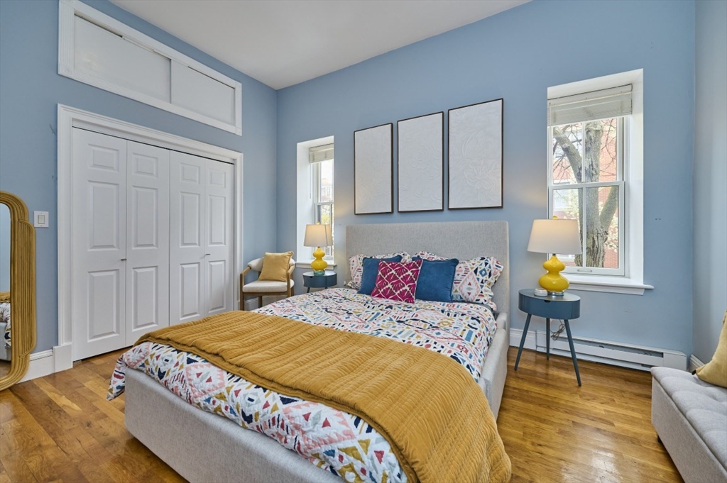 516 Shawmut Avenue, Unit 2 Boston, MA 02118 - Photo 9 of 13 a bedroom with a bed and window