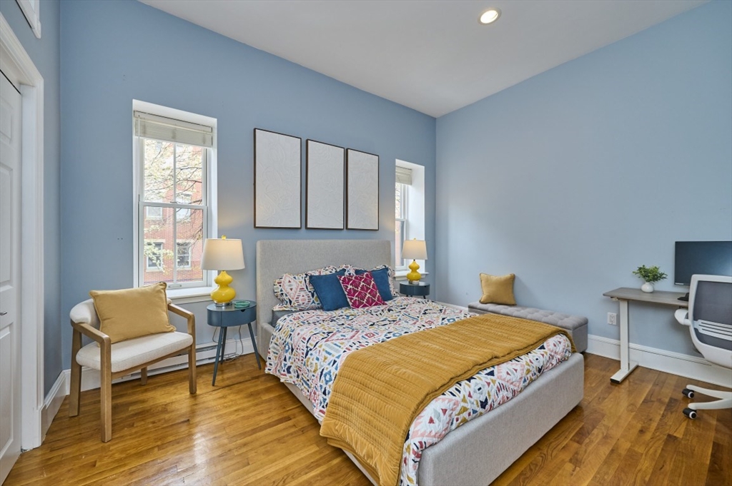516 Shawmut Avenue, Unit 2 Boston, MA 02118 - Photo 10 of 13 a bedroom with a bed and a couch
