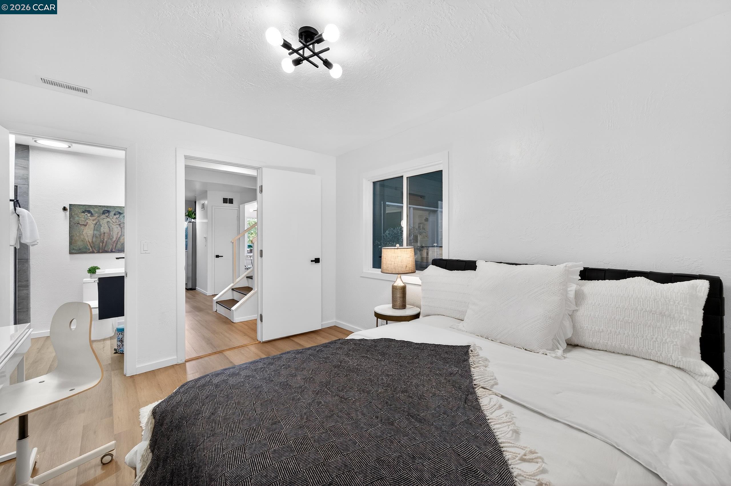 230 Fairlawn Drive Berkeley, CA 94708 - Photo 28 of 58 a bed room with a bed and a mirror