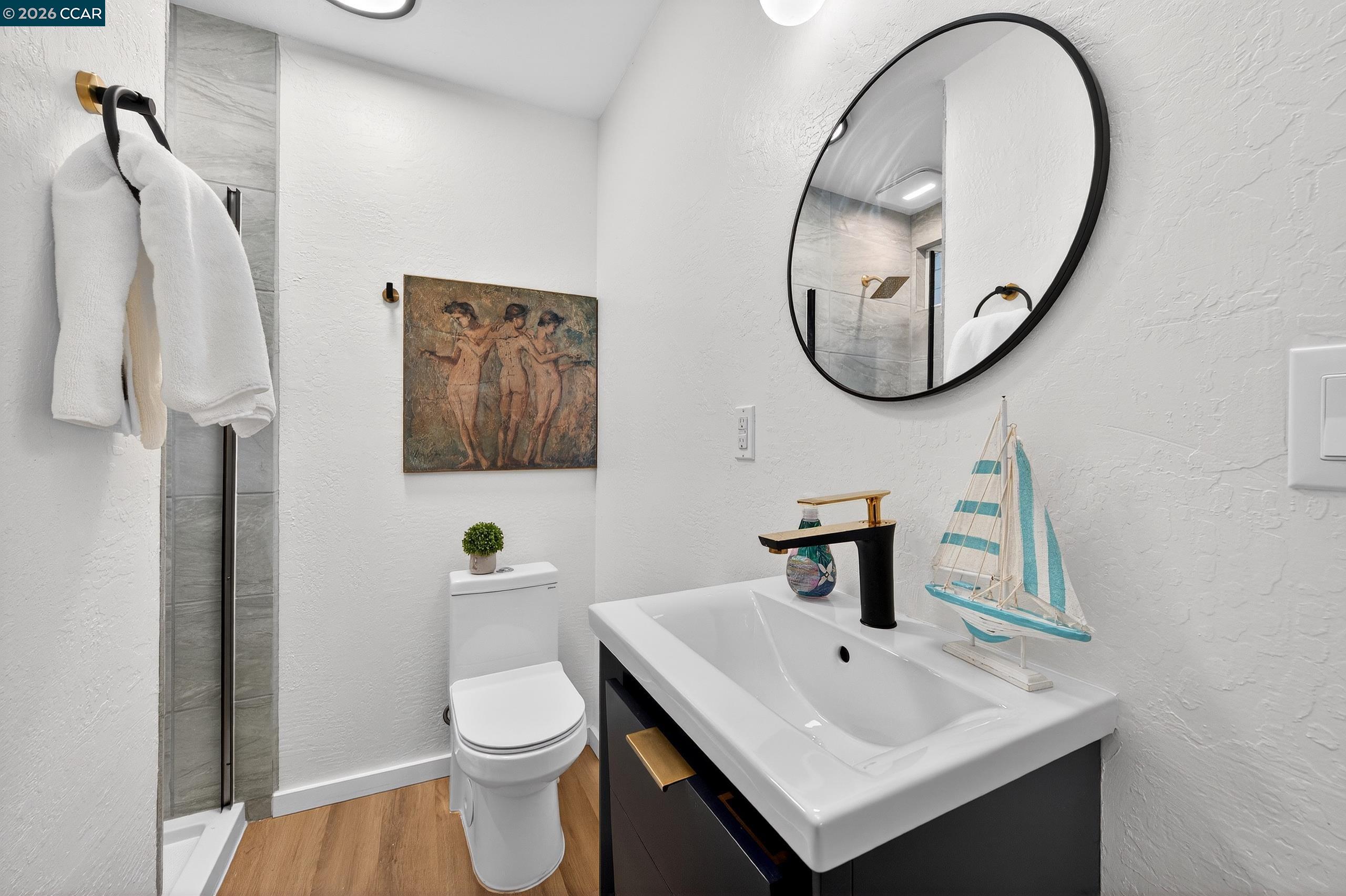 230 Fairlawn Drive Berkeley, CA 94708 - Photo 29 of 58 a bathroom with a sink and a mirror