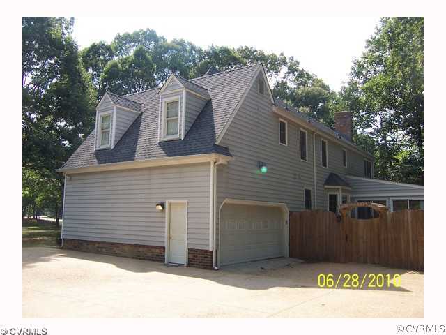 13001 Rivers Bend Road Chester, VA 23836 - Photo 4 of 12 a view of a house with a garage