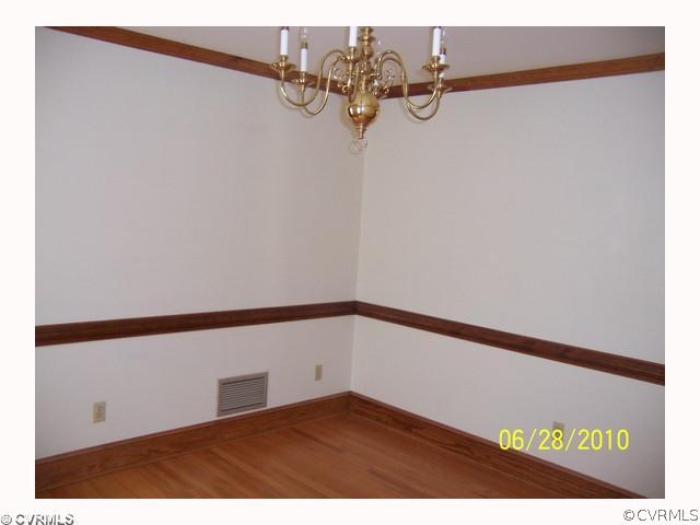 13001 Rivers Bend Road Chester, VA 23836 - Photo 10 of 12 a view of a room with rack on the wall