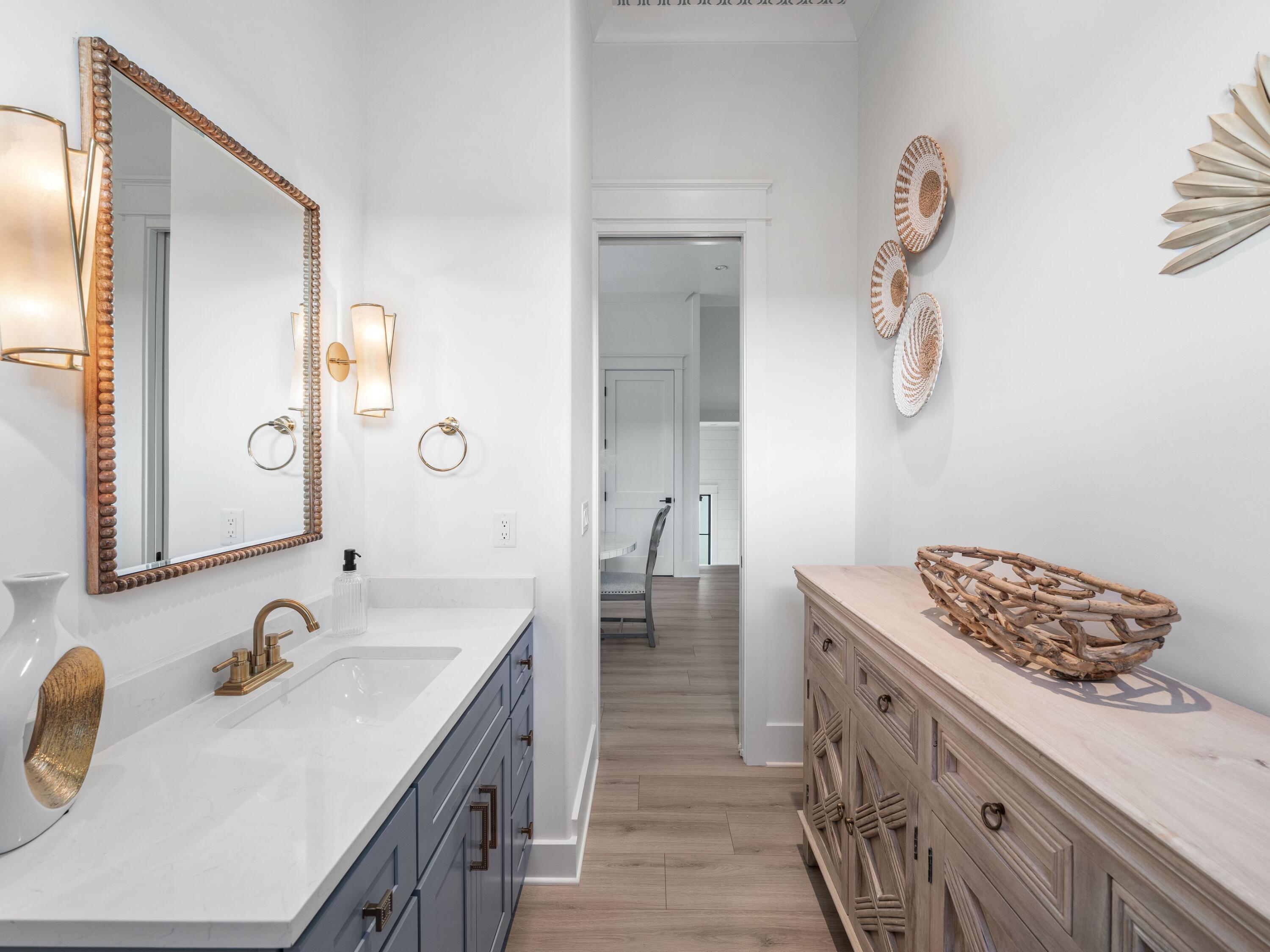 394 Grande Pointe Cir Inlet Beach Inlet Beach, FL 32461 - Photo 17 of 54 a bathroom with a sink and a mirror