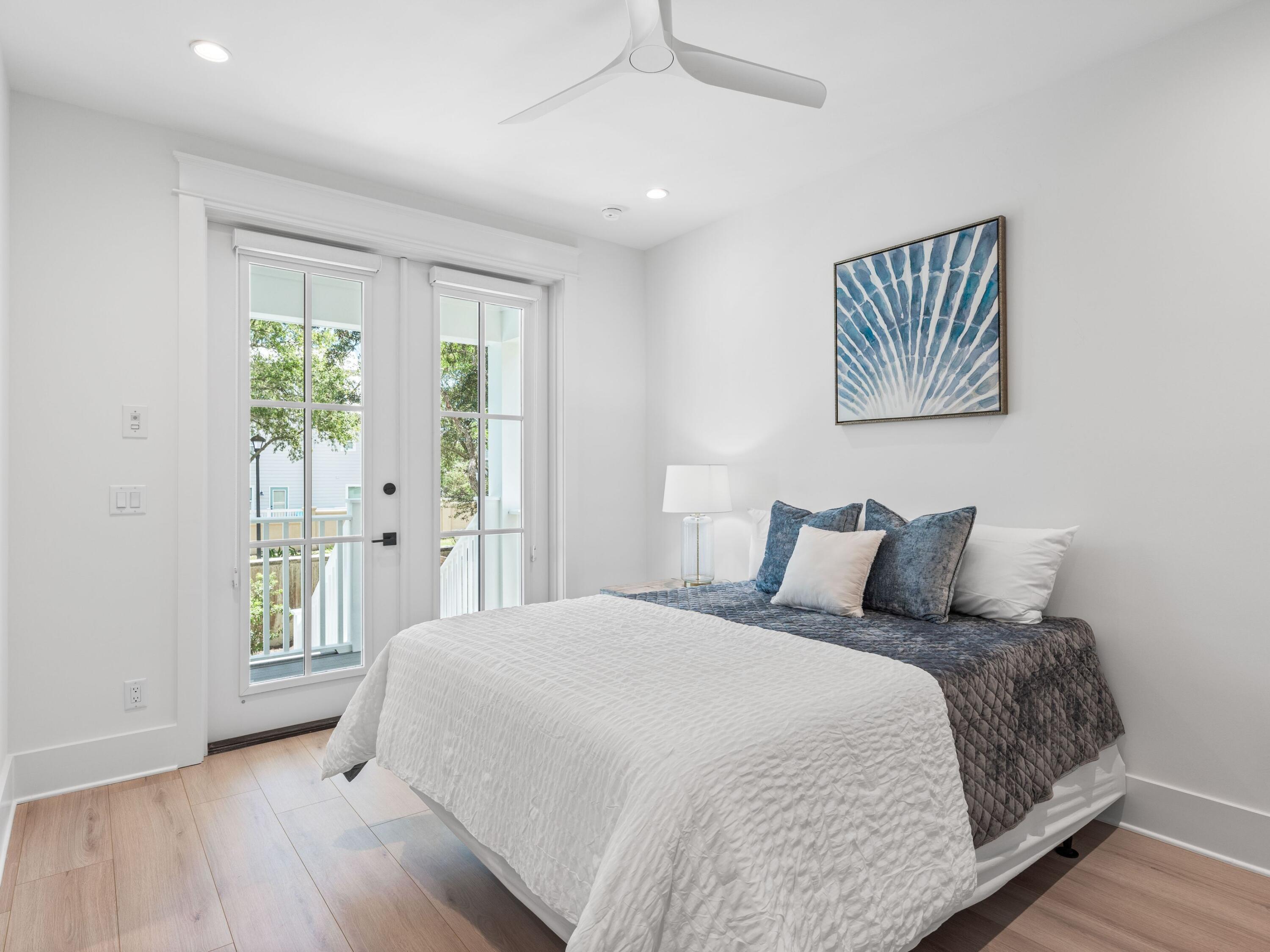394 Grande Pointe Cir Inlet Beach Inlet Beach, FL 32461 - Photo 26 of 54 a bedroom with a bed and a window