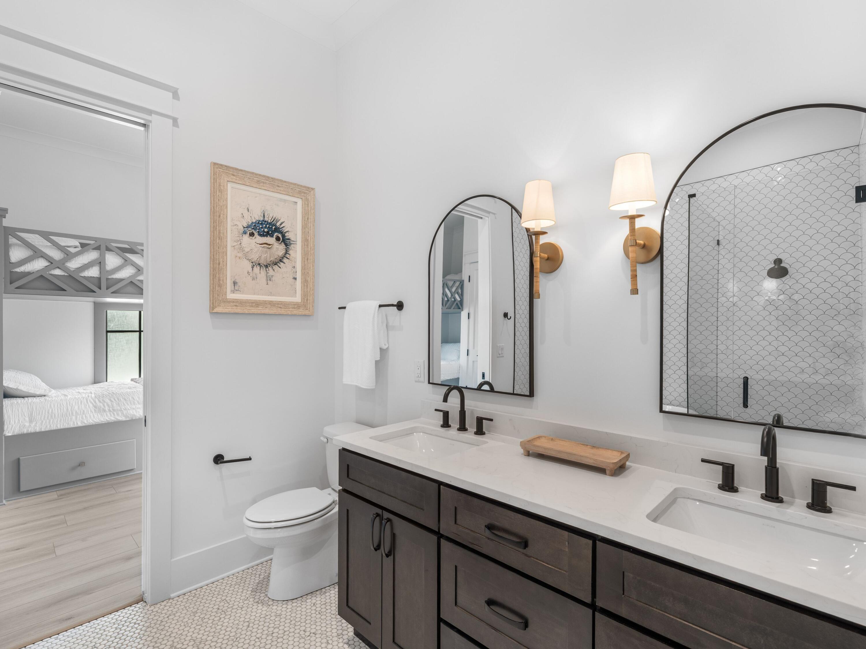 394 Grande Pointe Cir Inlet Beach Inlet Beach, FL 32461 - Photo 31 of 54 a bathroom with a double vanity sink toilet and a mirror