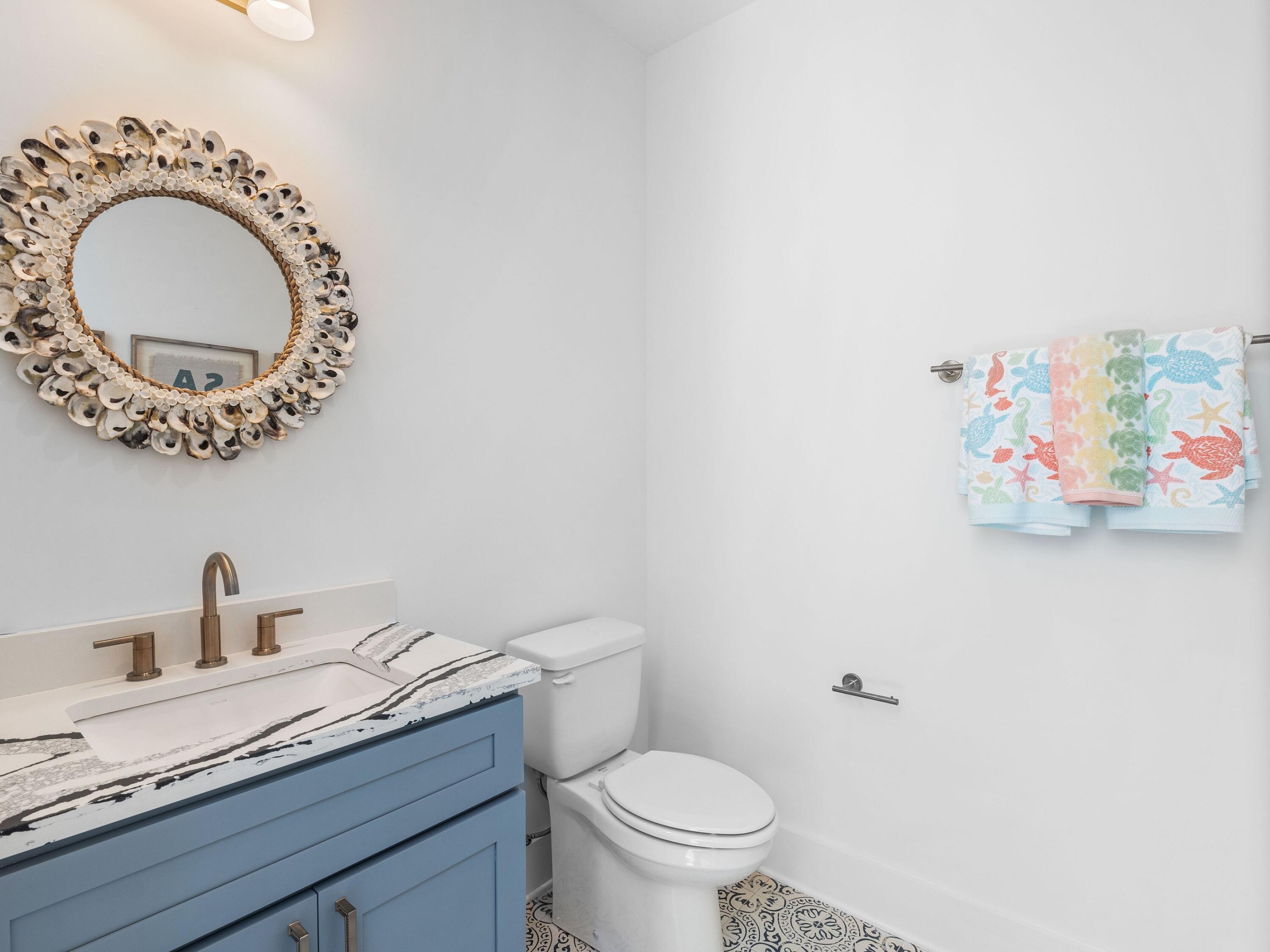 394 Grande Pointe Cir Inlet Beach Inlet Beach, FL 32461 - Photo 43 of 54 a bathroom with a toilet and a sink