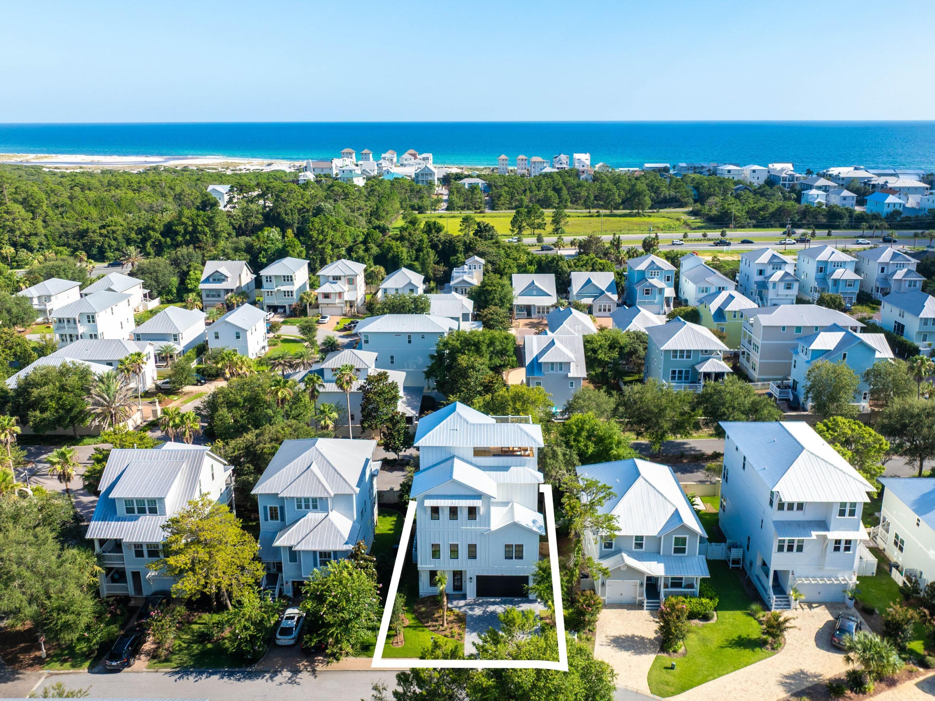 394 Grande Pointe Cir Inlet Beach Inlet Beach, FL 32461 - Photo 51 of 54 an aerial view of residential houses with outdoor space and swimming pool
