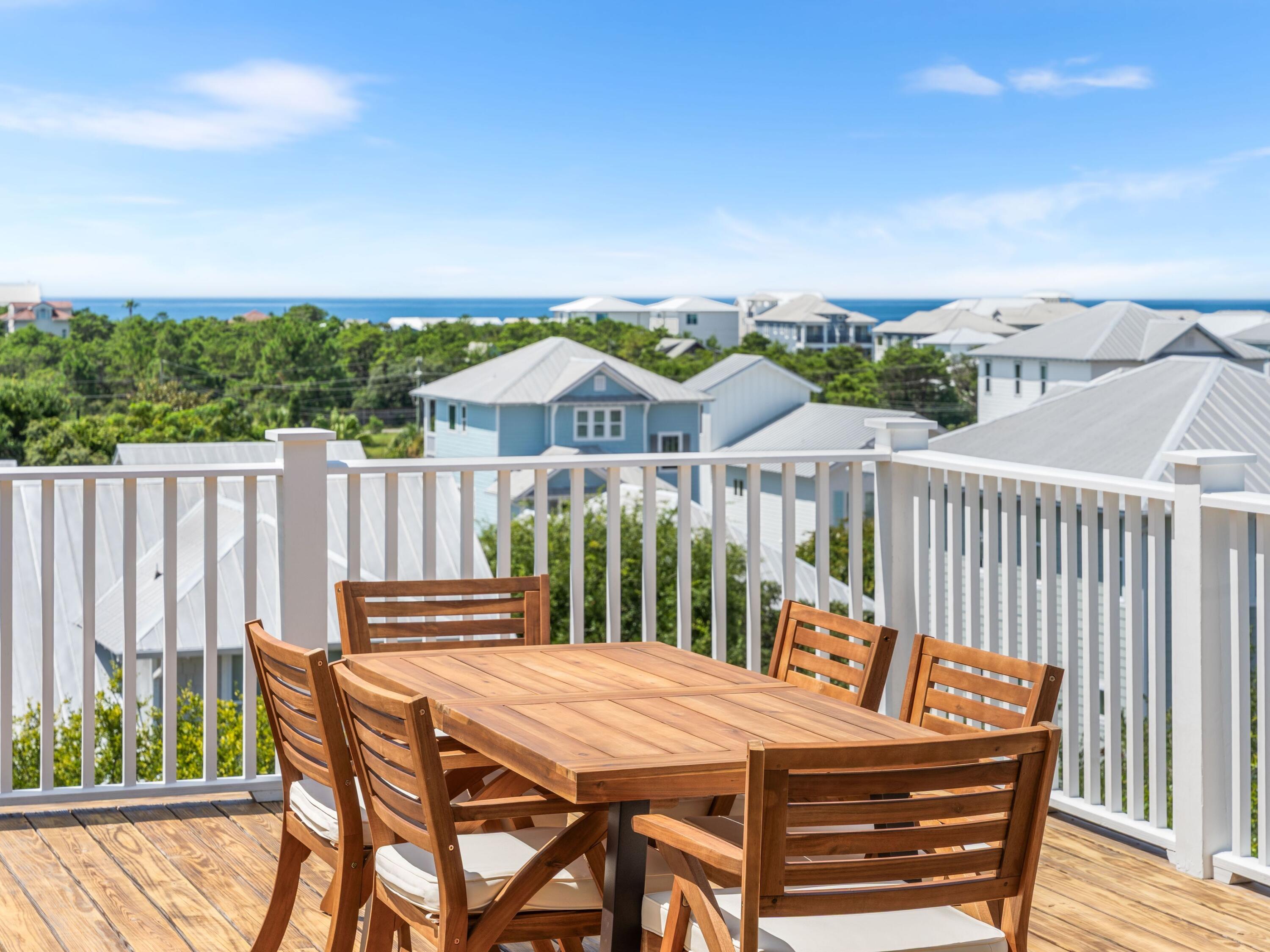 394 Grande Pointe Cir Inlet Beach Inlet Beach, FL 32461 - Photo 52 of 54 a view of a chairs and table on the deck