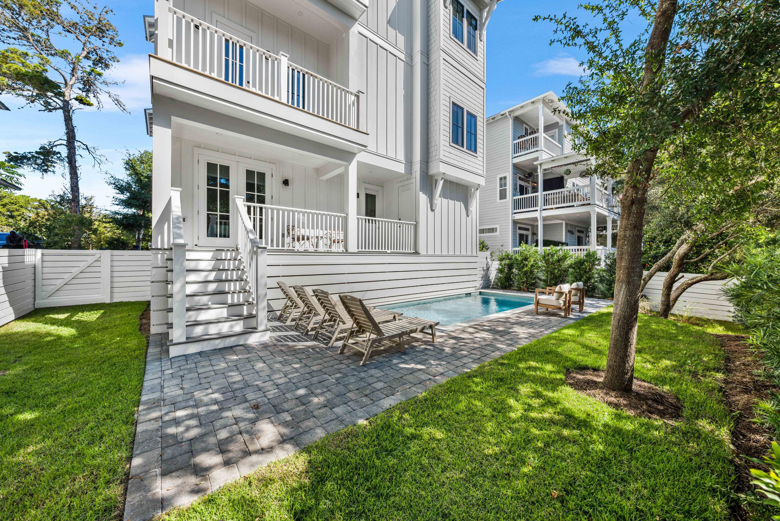 394 Grande Pointe Cir Inlet Beach Inlet Beach, FL 32461 - Photo 54 of 54 a view of a house with backyard and sitting area