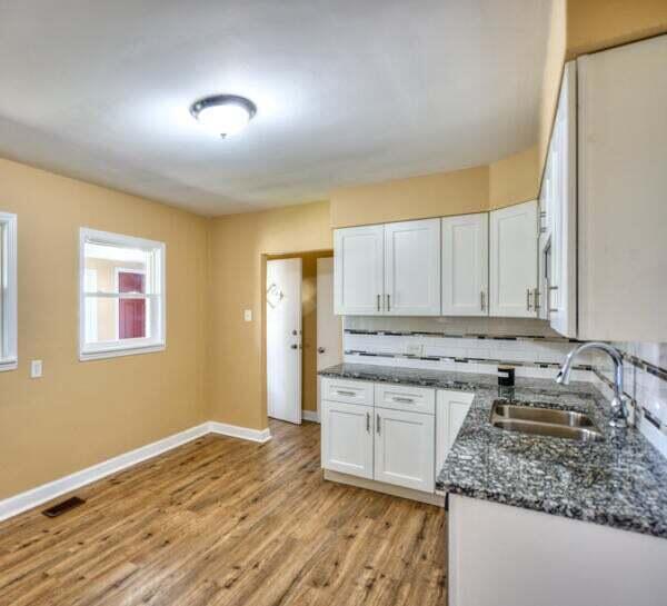3701 Monroe Street Gary, IN 46408 - Photo 5 of 22 a kitchen with a sink stove and cabinets