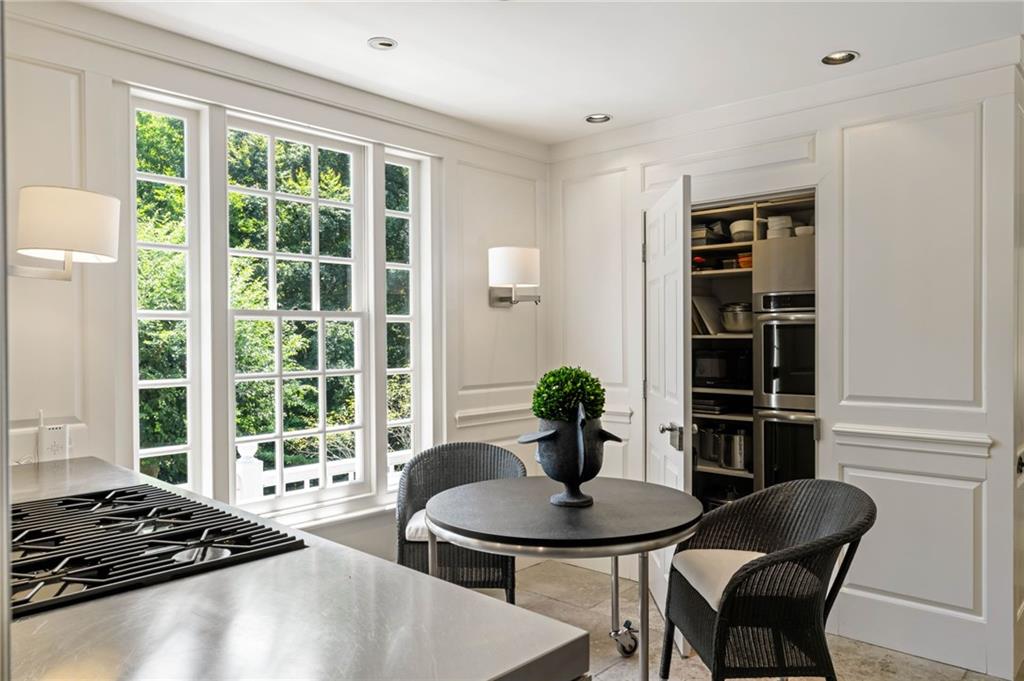 1727 West Paces Ferry Road Northwest Atlanta, GA 30327 - Photo 11 of 26 a view of a dining room with furniture window and outside view