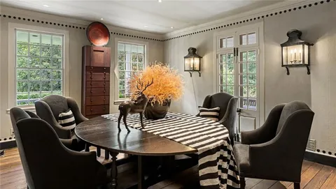 a view of a dining room with furniture window and outside view