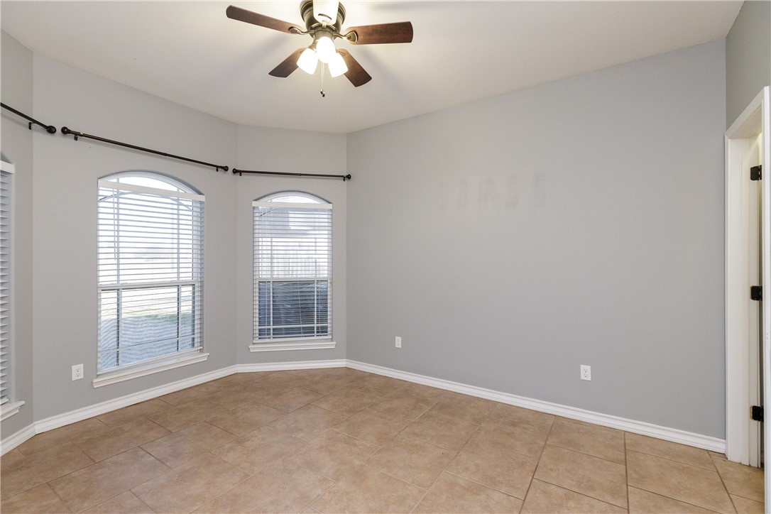 8314 Excalibur Road Corpus Christi, TX 78414 - Photo 14 of 26 an empty room with windows and chandelier fan