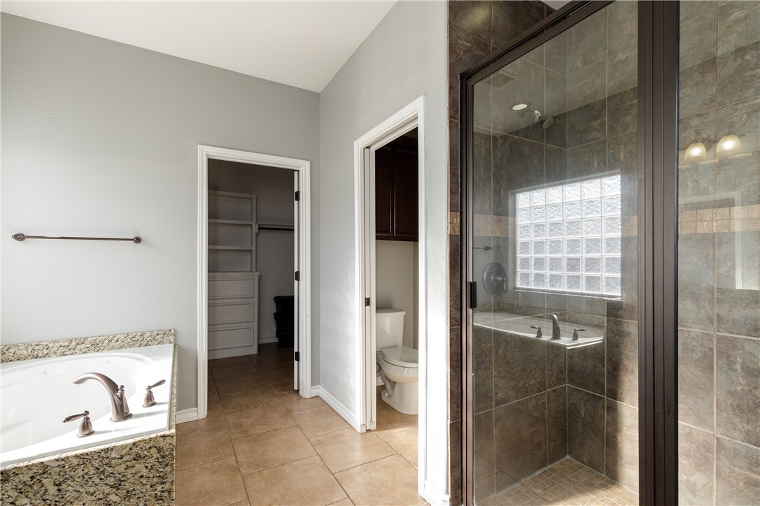 8314 Excalibur Road Corpus Christi, TX 78414 - Photo 20 of 26 a bathroom with a bathtub and a shower