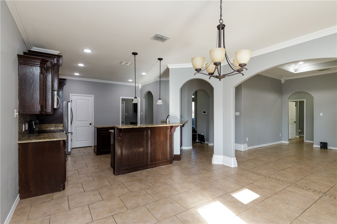 8314 Excalibur Road Corpus Christi, TX 78414 - Photo 5 of 26 a view of a kitchen with a sink and refrigerator