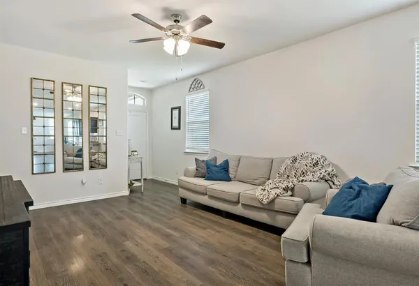a living room with furniture and a large window