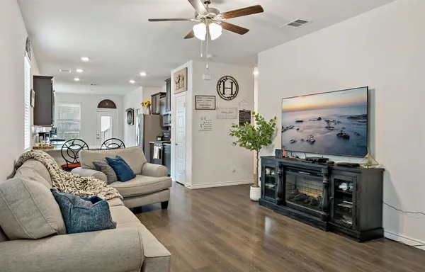 a living room with furniture and a fireplace