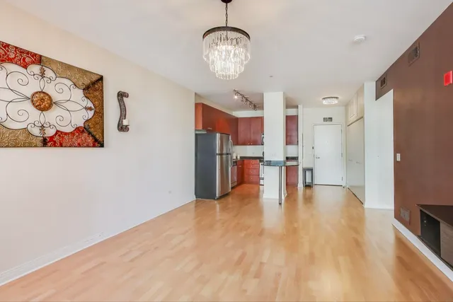 a view of a kitchen with a refrigerator a stove top oven a sink and dishwasher