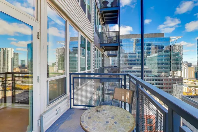 a view of an outdoor kitchen from a balcony
