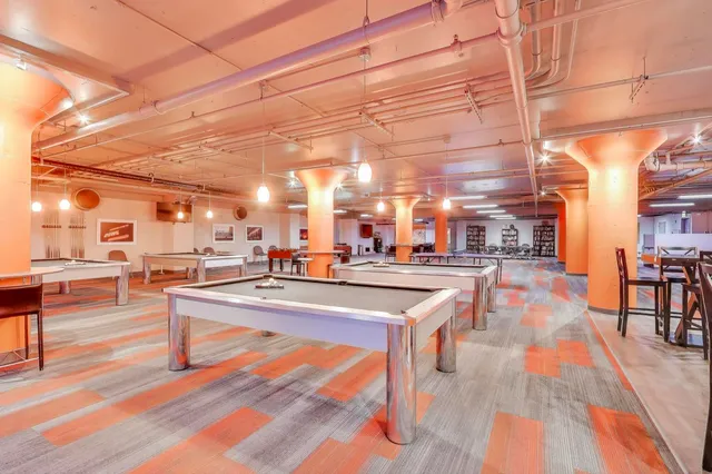 a view of a patio with a table and chairs