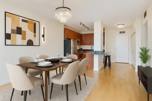 a view of a dining room with furniture and wooden floor