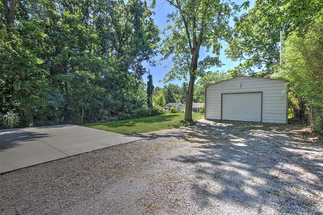 2925 East Main Street Decatur, IL 62521 - Photo 18 of 20 a view of a house with a yard and garage