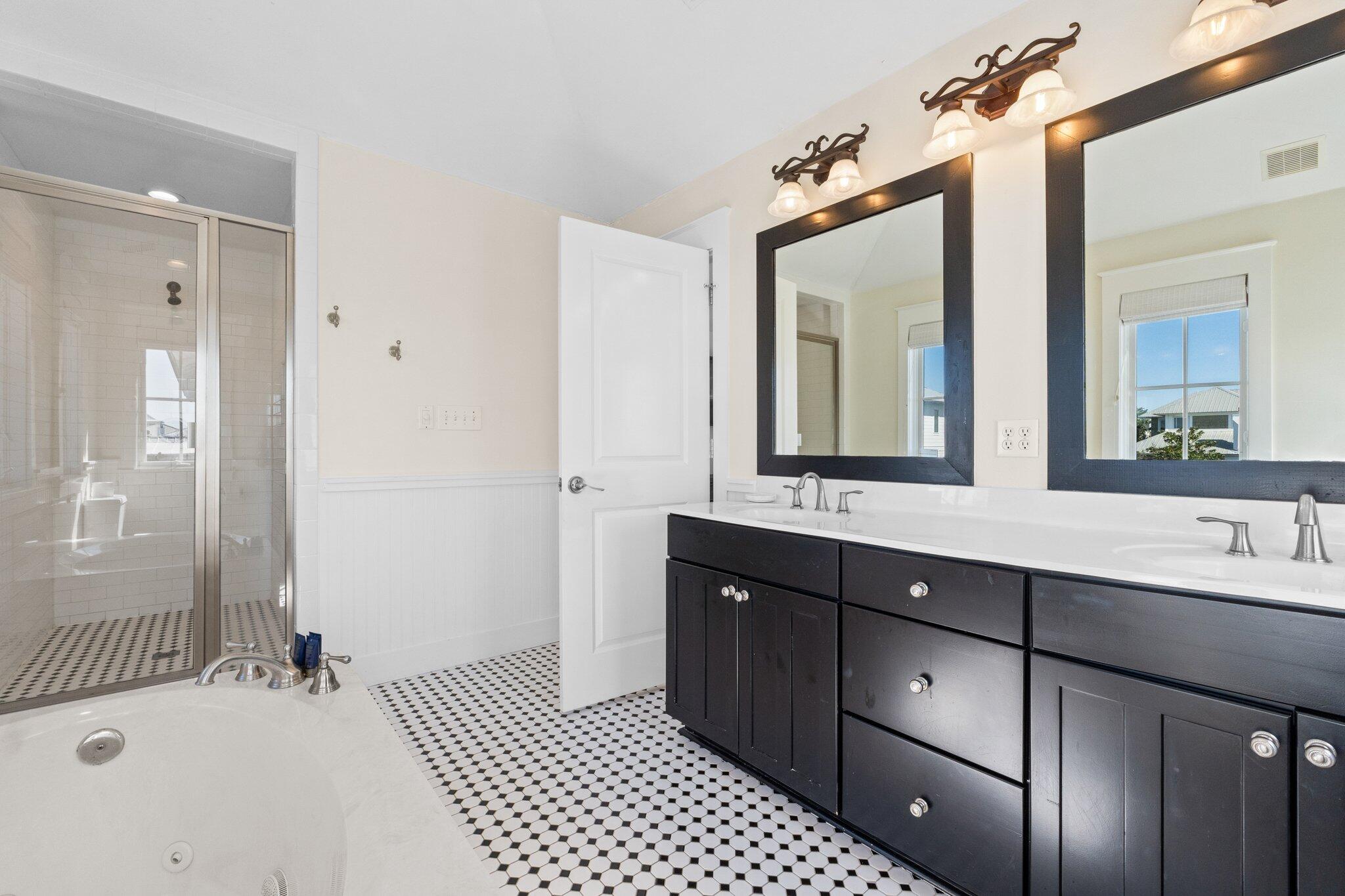 64 Chelsea Loop Road Santa Rosa Beach, FL 32459 - Photo 11 of 57 a bathroom with a double vanity sink mirror and bathtub