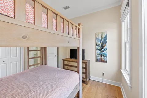 a bathroom with a toilet sink vanity and mirror