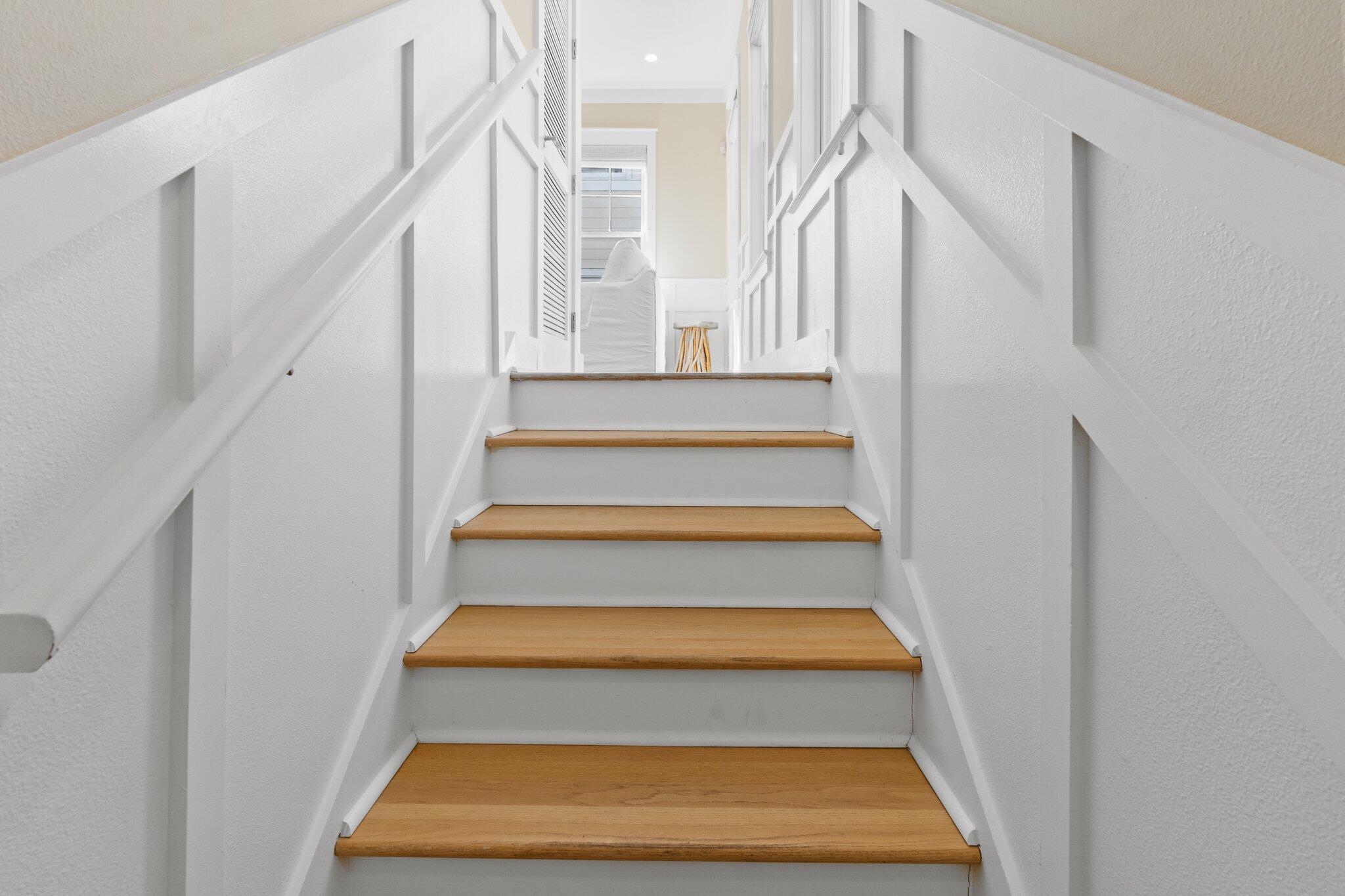 64 Chelsea Loop Road Santa Rosa Beach, FL 32459 - Photo 20 of 57 a view of staircase with white walls and a rug