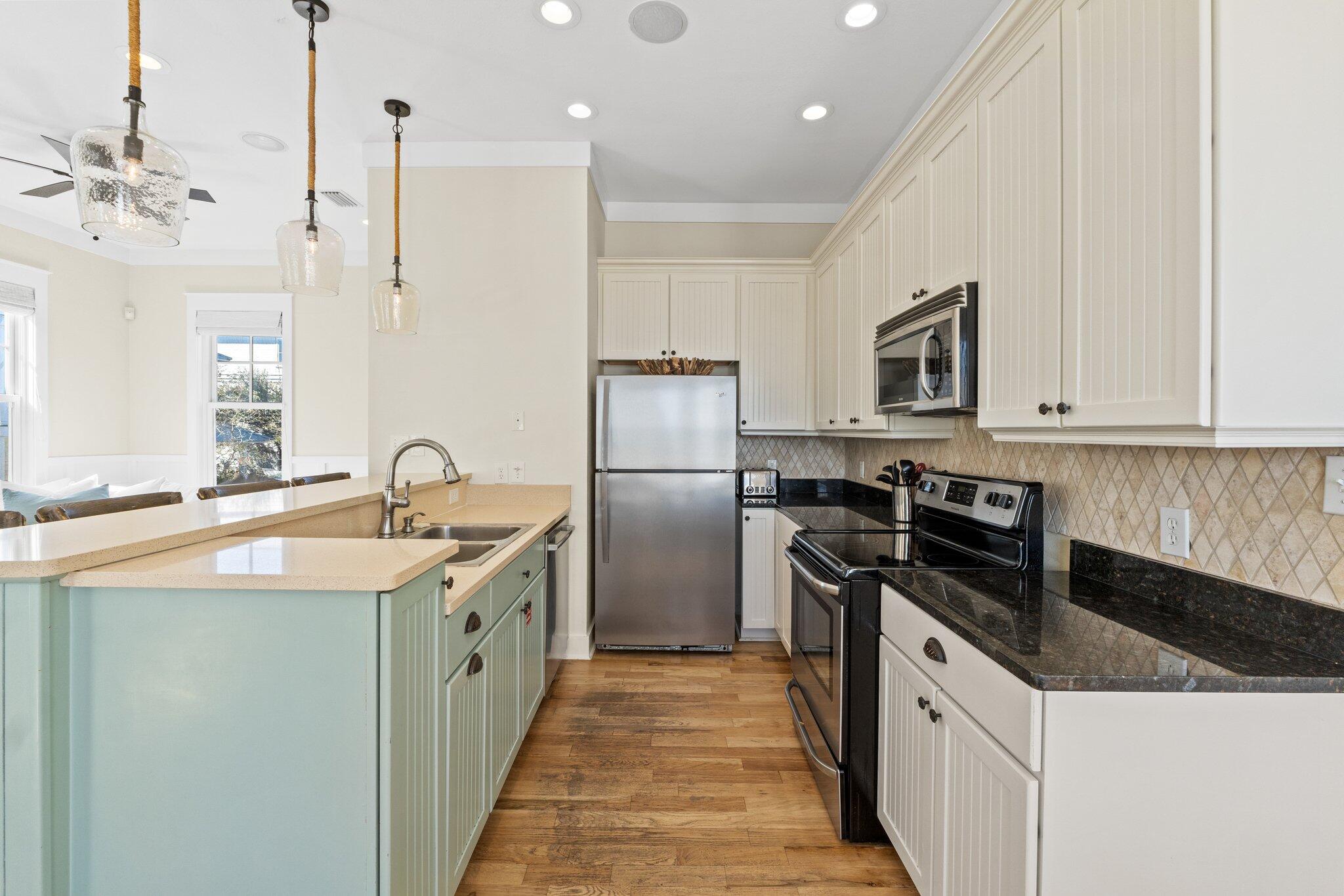 64 Chelsea Loop Road Santa Rosa Beach, FL 32459 - Photo 26 of 57 a kitchen with a sink stove and refrigerator