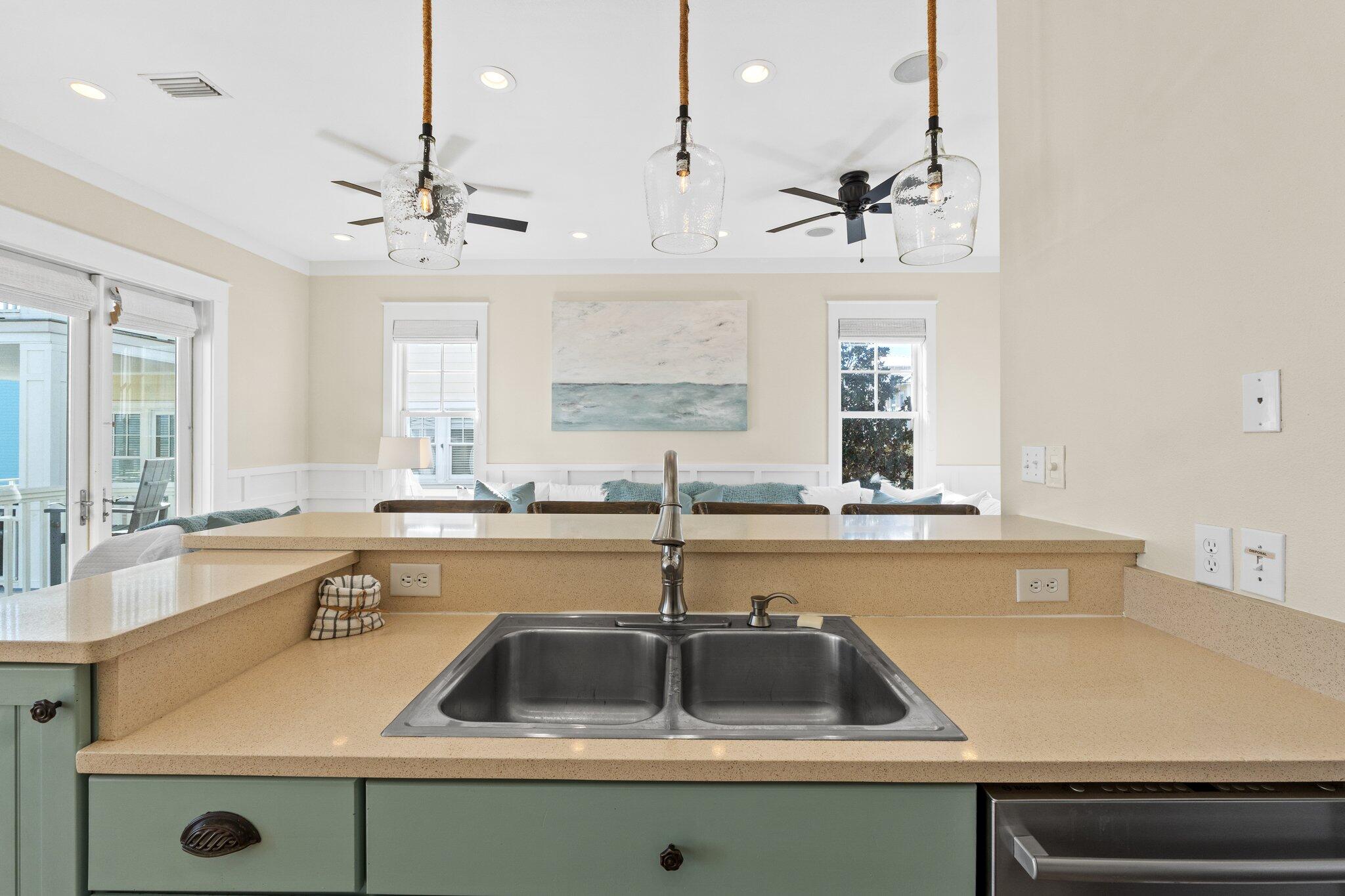 64 Chelsea Loop Road Santa Rosa Beach, FL 32459 - Photo 28 of 57 a kitchen with a sink a counter and cabinets