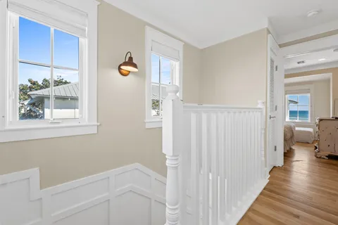a bedroom with a bed and a flat tv screen on a dresser