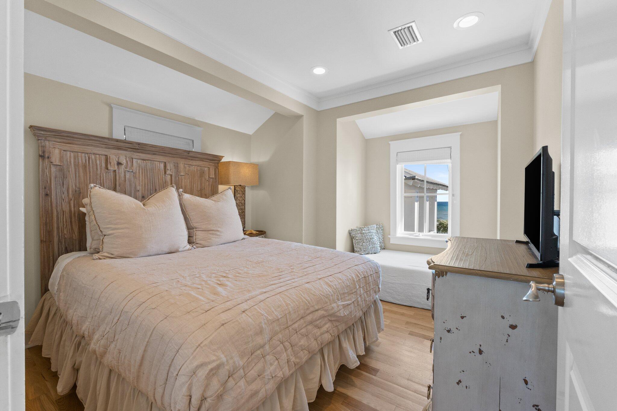 64 Chelsea Loop Road Santa Rosa Beach, FL 32459 - Photo 35 of 57 a bedroom with a bed and a flat screen tv