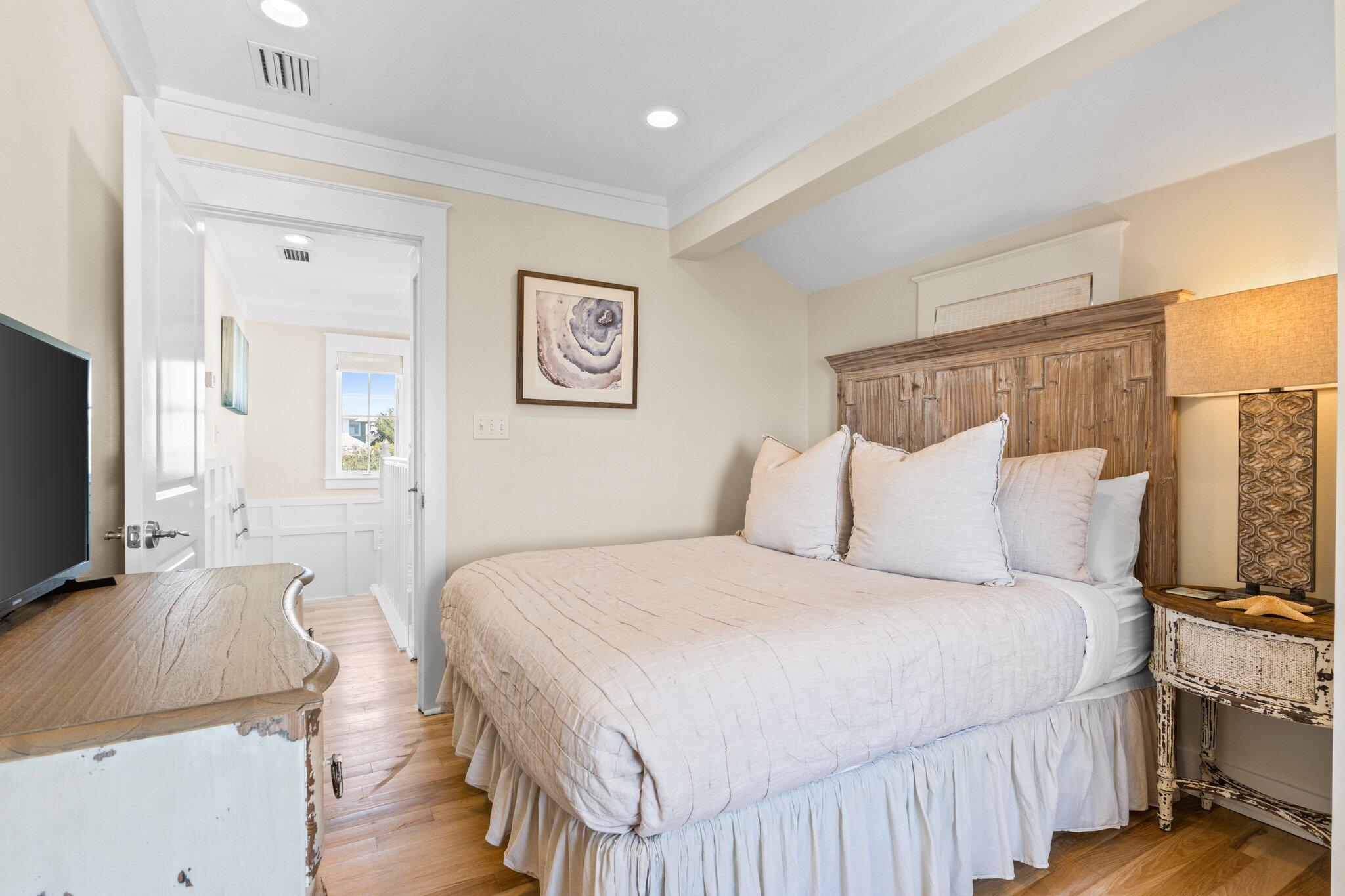 64 Chelsea Loop Road Santa Rosa Beach, FL 32459 - Photo 37 of 57 a bedroom with a bed and a flat screen tv