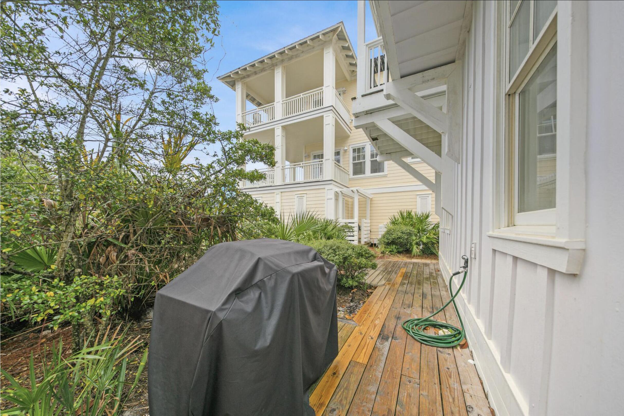 64 Chelsea Loop Road Santa Rosa Beach, FL 32459 - Photo 50 of 57 a view of a house with backyard and sitting area