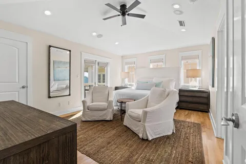 a bathroom with a double vanity sink mirror and bathtub