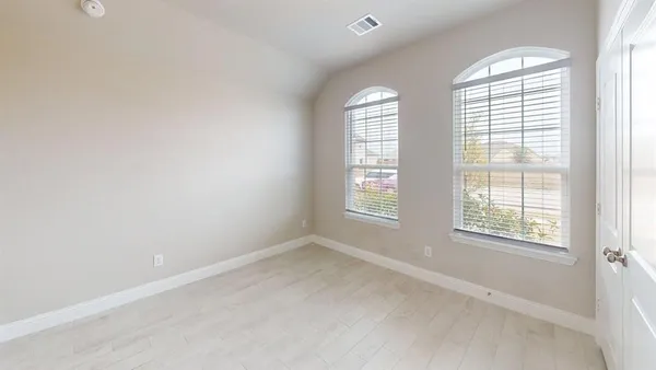 an empty room with windows