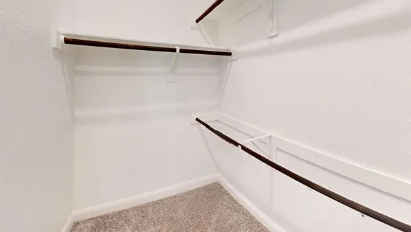 a bathroom with a double vanity sink a toilet and a bathtub