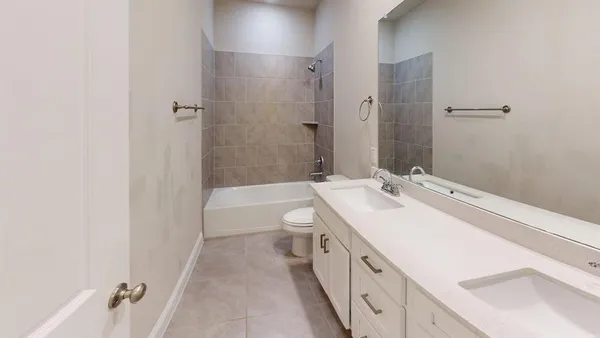 a bathroom with a bathtub and a sink
