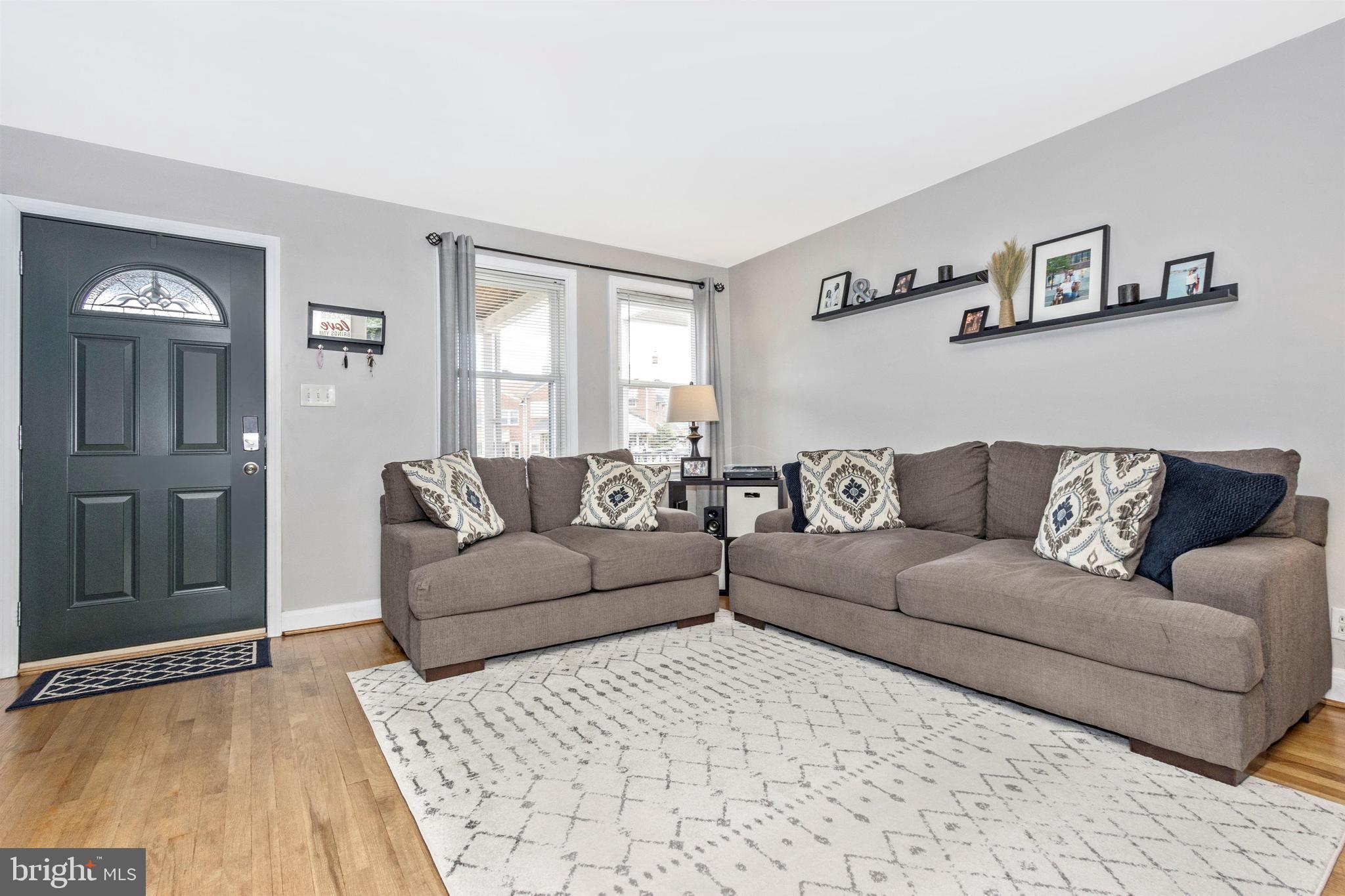 1136 Elm Road Baltimore, MD 21227 - Photo 2 of 19 Spacious living room with plenty of natural light