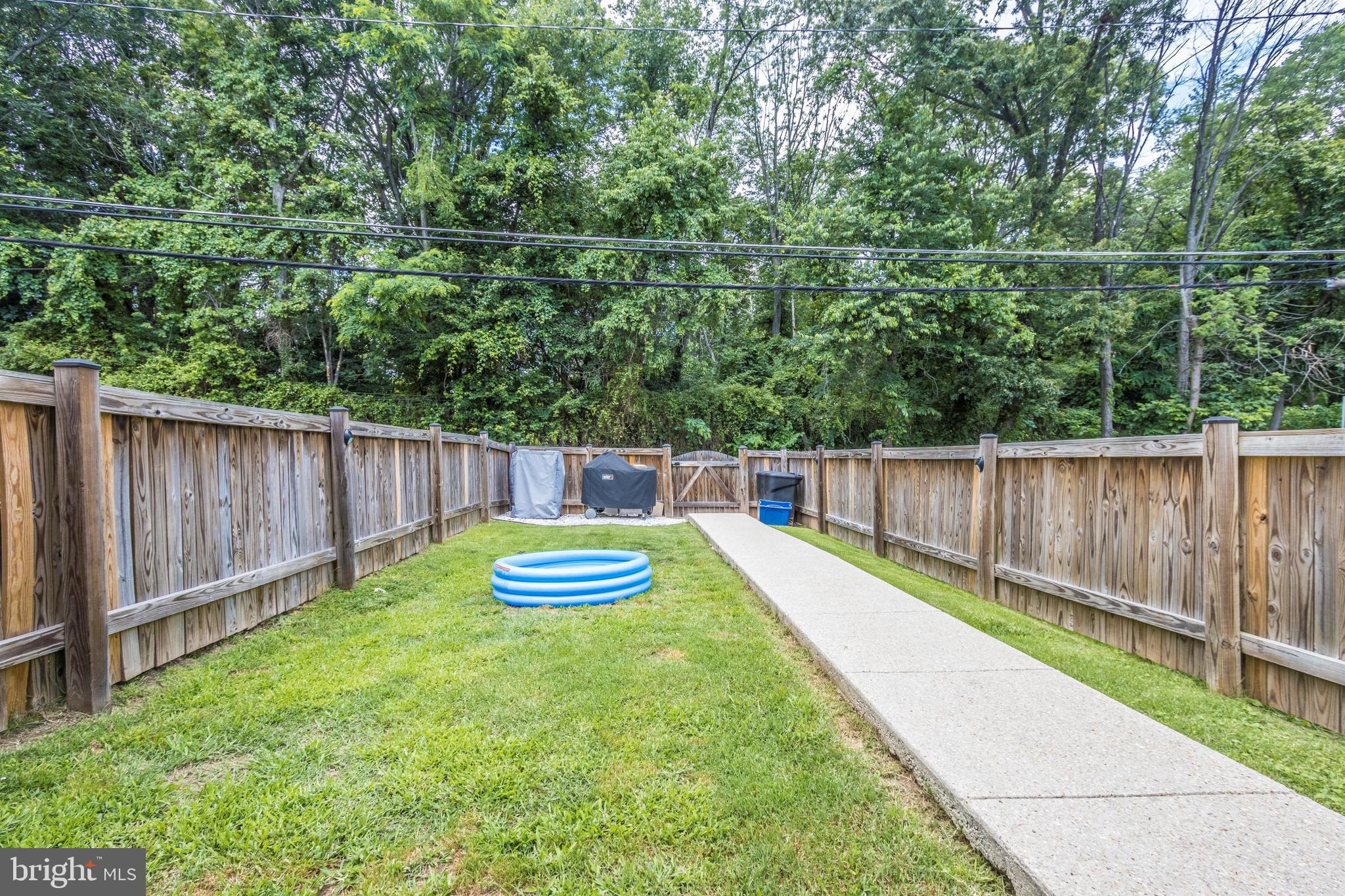 1136 Elm Road Baltimore, MD 21227 - Photo 14 of 19 Fenced rear yard with new concrete walk way