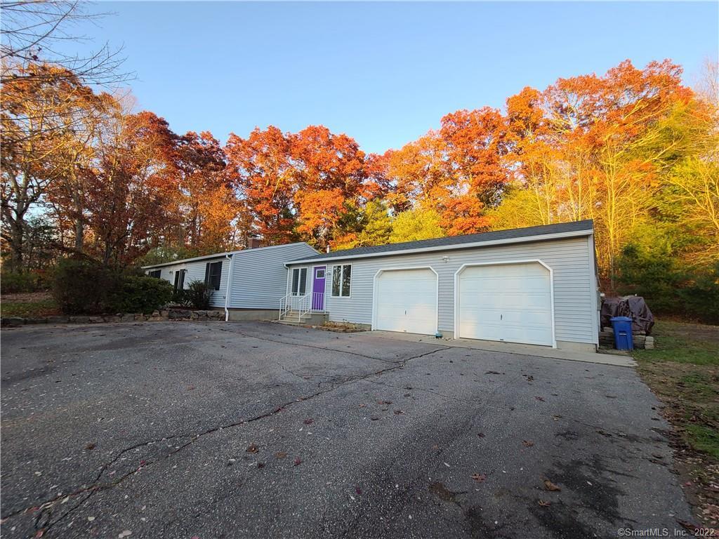 112 Paper Mill Road Lisbon, CT 06351 - Photo 1 of 1 a view of a grey house with a road