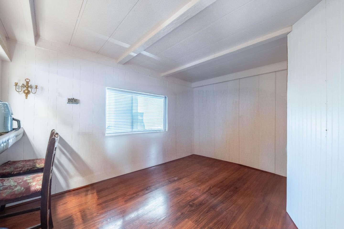 13624 Monte Del Sol, Unit 142 Castroville, CA 95012 - Photo 12 of 25 a view of a livingroom with wooden floor and a window