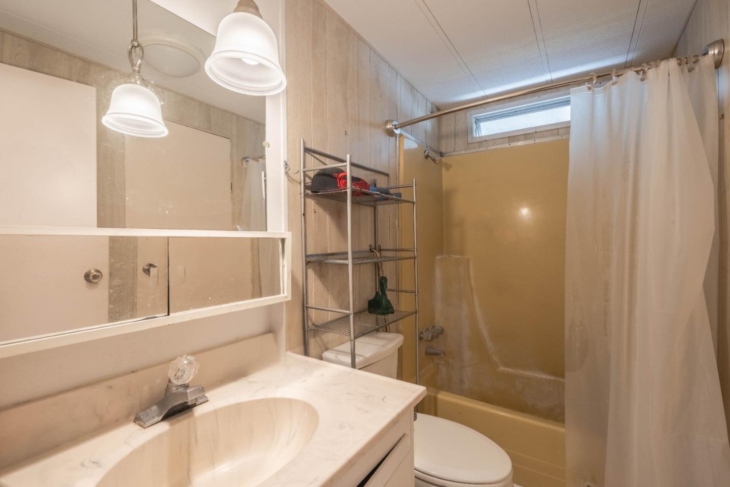 13624 Monte Del Sol, Unit 142 Castroville, CA 95012 - Photo 19 of 25 a bathroom with a sink toilet and shower