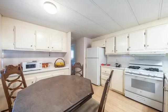 a view of hallway with wooden floor