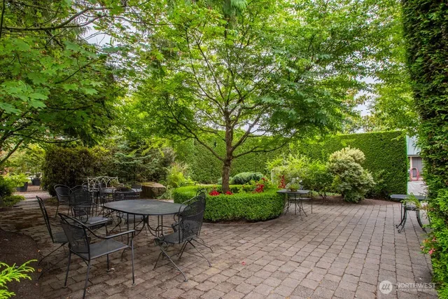 a outdoor space with patio furniture and a large window
