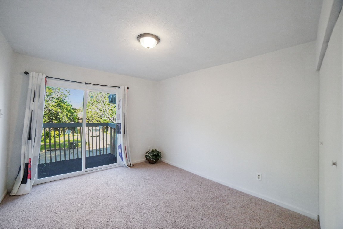 12323 Split Rail Lane Houston, TX 77071 - Photo 17 of 29 a view of an empty room with wooden floor and a window