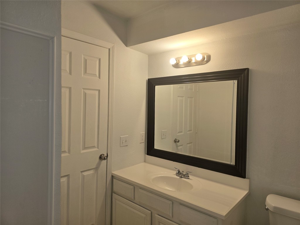 12323 Split Rail Lane Houston, TX 77071 - Photo 20 of 29 a bathroom with a sink vanity and a mirror